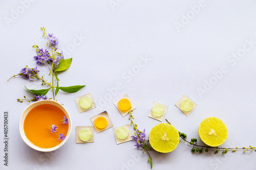 Photography cough sore throat pastille pills from herbal honey and lemon with purple flowers