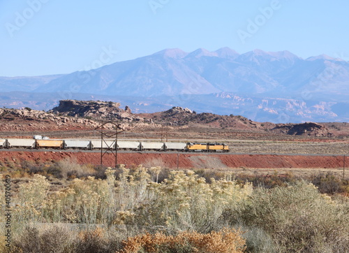 Goods train and the La Sal Mountain range, Moab, Utah