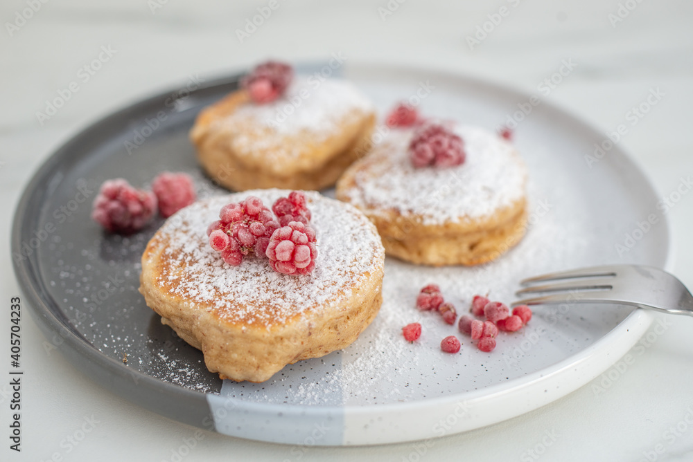 Tasty american pancakes with raspberries on a table Tasty american pancakes with raspberries on a table