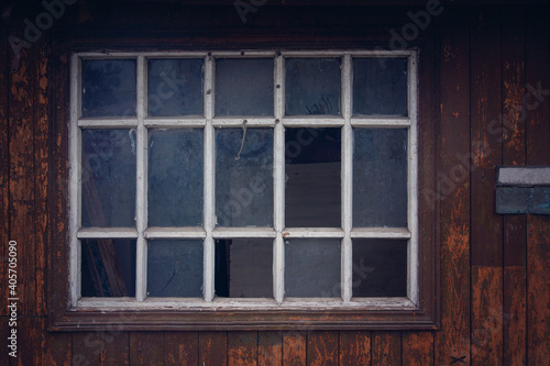 dark window in an old abandoned house