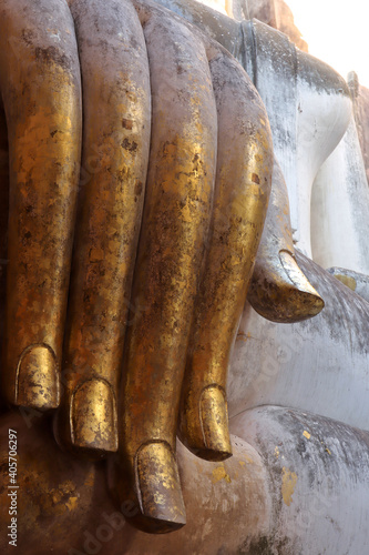 A Buddha statue at Wat Si Chum in the precinct of Sukhothai Historical Park. UNESCO World Heritage Site in Thailand.