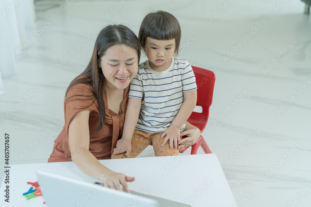 Play time, Cute little girl Pre-school learning activities dancing singing with VDO online learning with mother beside. Play time, Cute little girl Pre-school learning activities dancing singing with VDO online learning with mother beside.