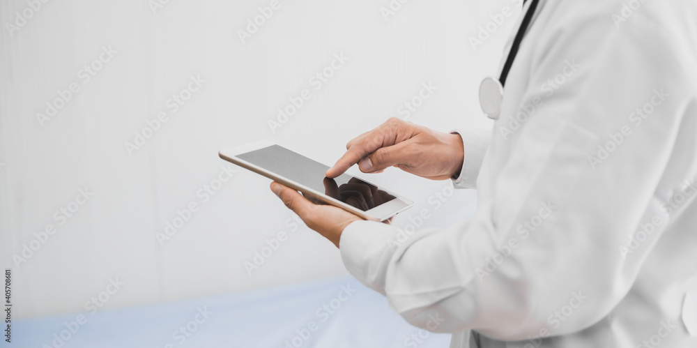 Doctor finger touching screen on digital tablet closeup Doctor finger touching screen on digital tablet closeup