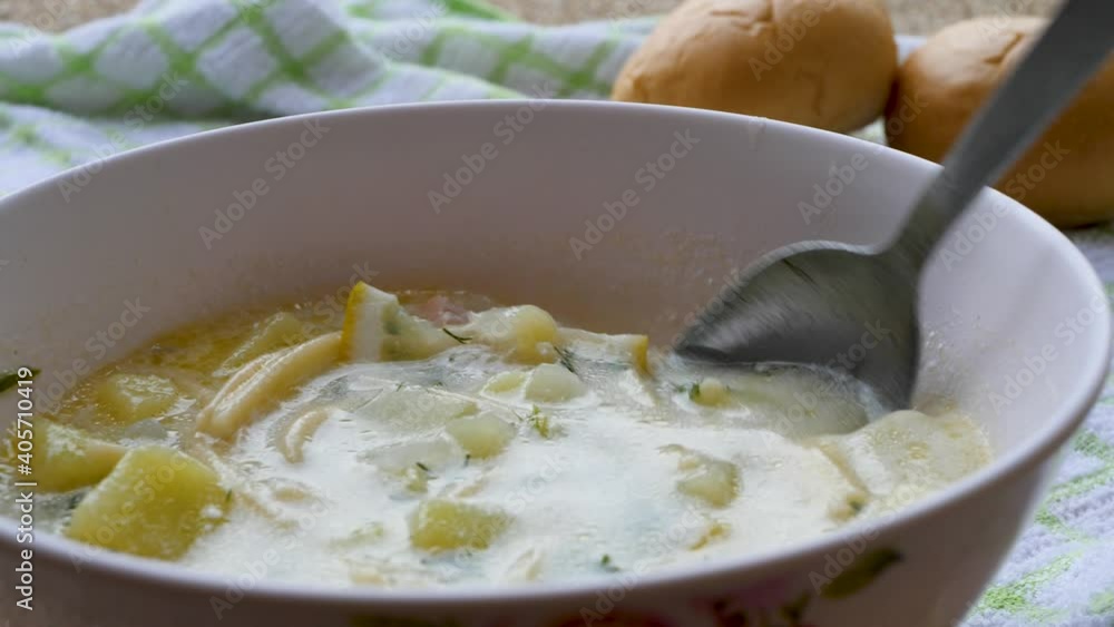 Summer fresh soup with boiled red fish meat slices, noodles, boiled potatoes, sour cream and lemon Summer fresh soup with boiled red fish meat slices, noodles, boiled potatoes, sour cream and lemon