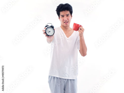 Man with alarm clock and cup coffee © jittima