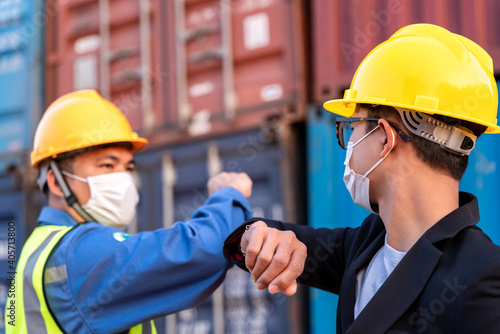Fotografie Asian industry construction site worker and foreman wearing hygiene face mask el