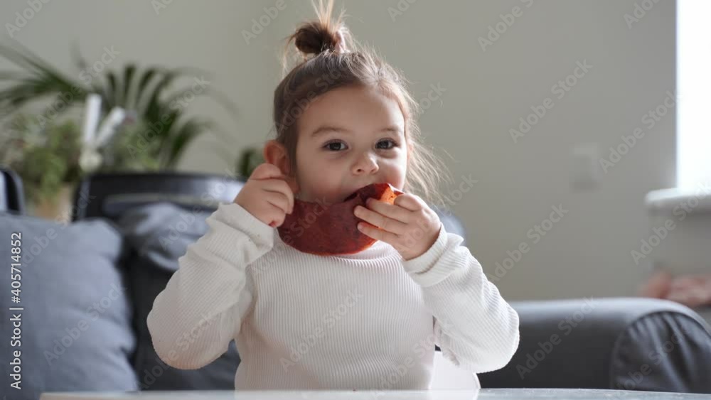 Child eating dried fruit leather for snack at home. Zero sugar natural