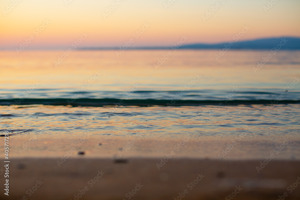 Obraz premium Sea water close-up at sunset