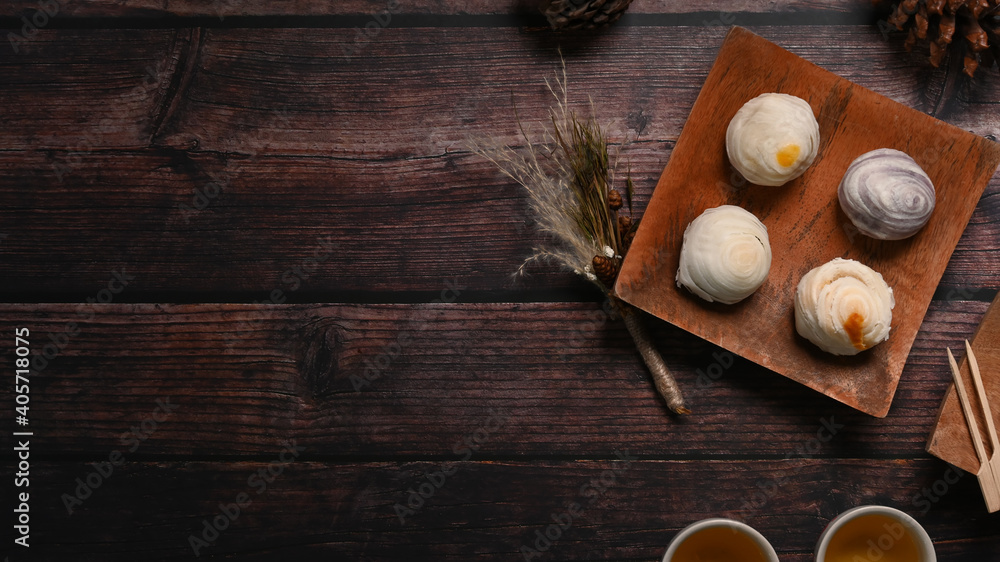Top view of Chinese pastry on wood dish and wood table with copy space. Dessert for Chinese new year. Top view of Chinese pastry on wood dish and wood table with copy space. Dessert for Chinese new year.