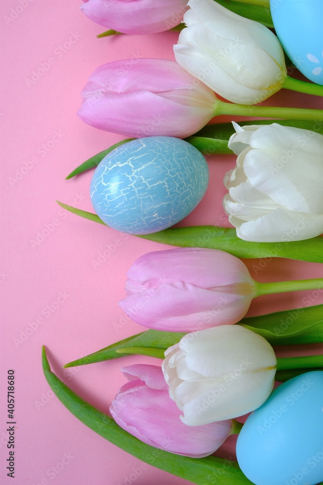 Easter holiday. White and pink tulips flowers, easter eggs set on a light pink background.Easter eggs and spring flowers in pastel colors set.Spring festive easter background.Easter symbol. Easter holiday. White and pink tulips flowers, easter eggs set on a light pink background.Easter eggs and spring flowers in pastel colors set.Spring festive easter background.Easter symbol.