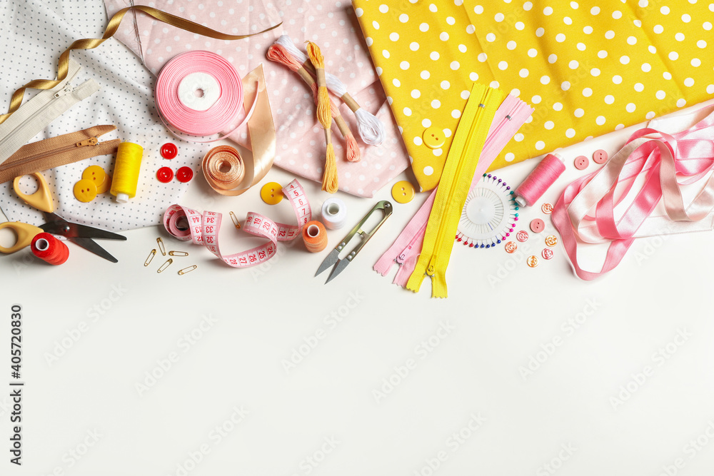Fototapeta premium Sewing supplies on white background, space for text