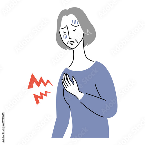 心臓が痛む様子のシニア女性