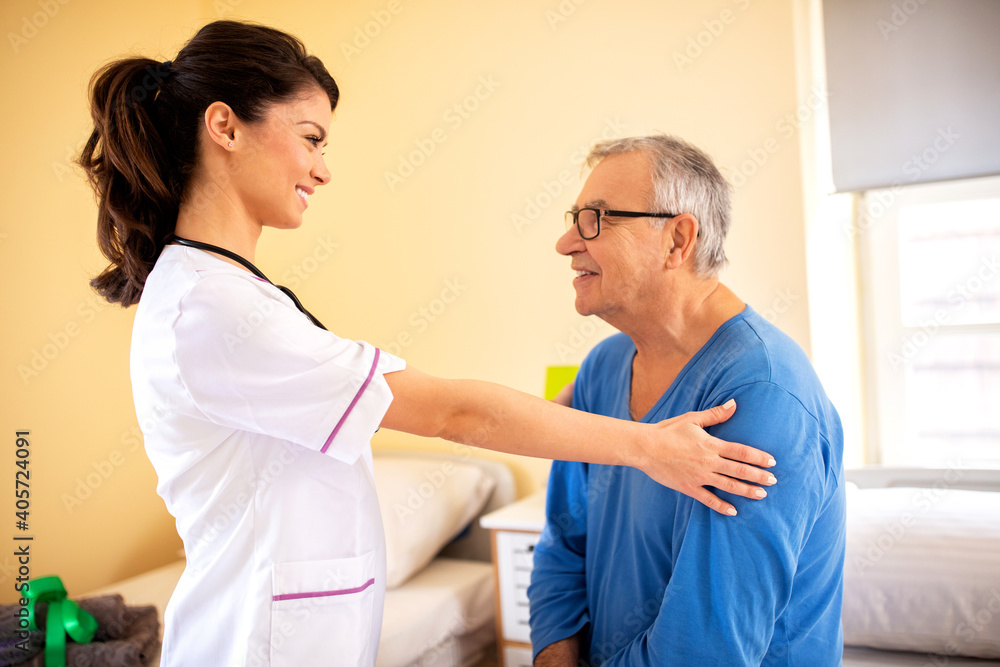 Nursing home doctor providing care to a senior man resident Nursing home doctor providing care to a senior man resident