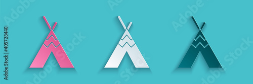 Paper cut Traditional indian teepee or wigwam icon isolated on blue background. Indian tent. Paper art style. Vector.
