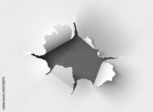 ragged Hole torn in ripped paper on background