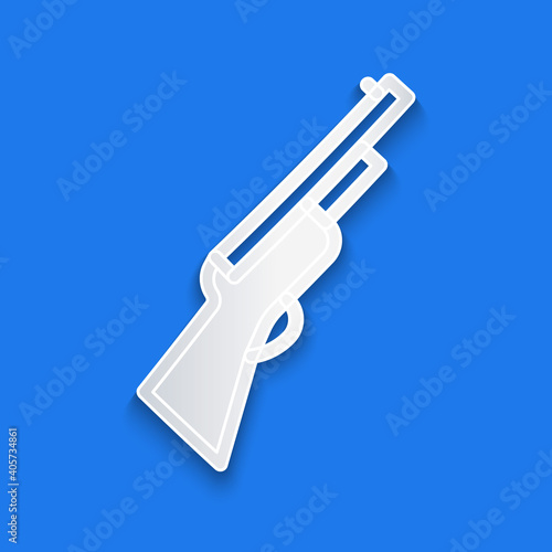 Paper cut Hunting gun icon isolated on blue background. Hunting shotgun. Paper art style. Vector.