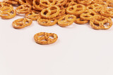yellow pretzels stacked in a heap on the far side