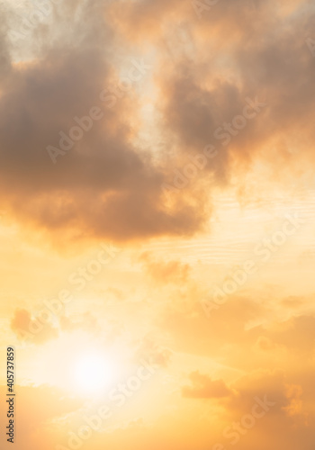 Orange sunrise sky vertical background in the morning with colorful nature sunset. © Nature Peaceful 