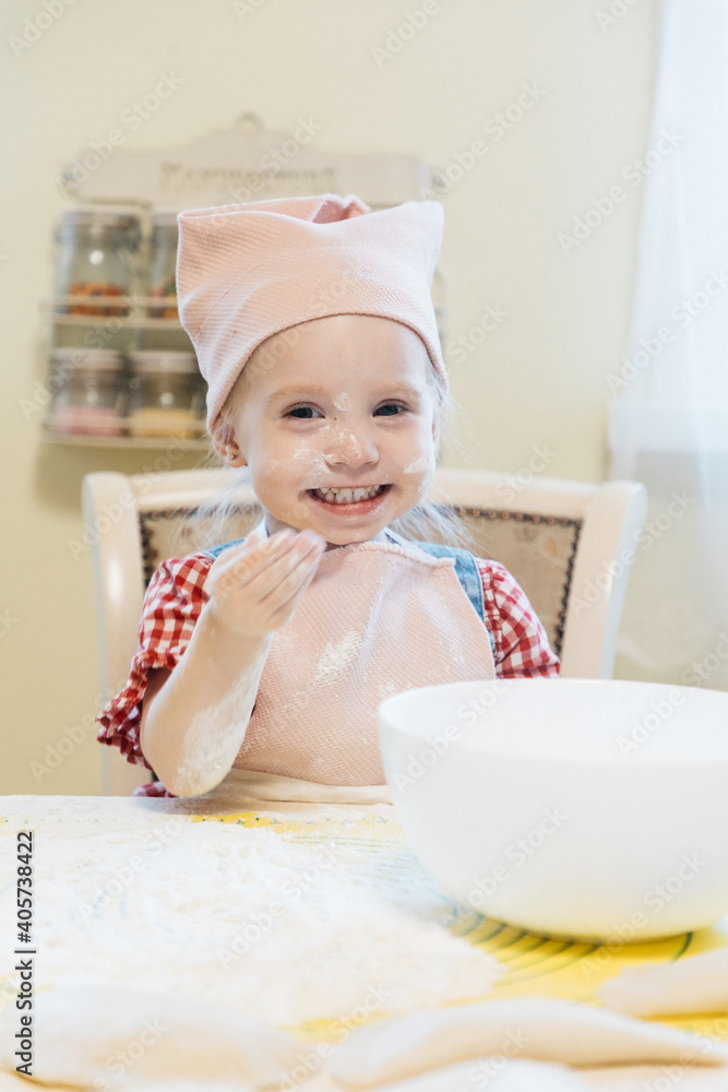 Little girl baking in the kitchen at home Little girl baking in the kitchen at home