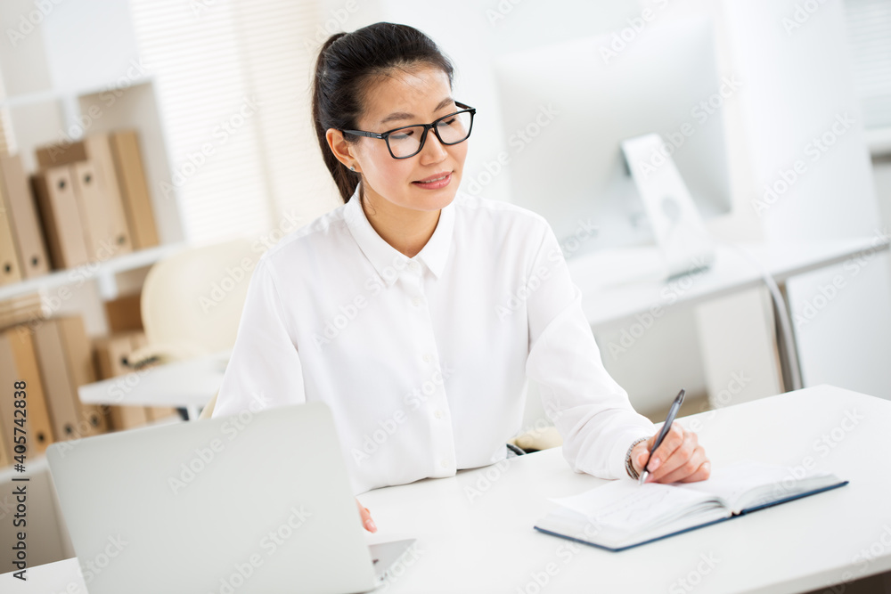 Portrait of asian business woman at workplace in office Portrait of asian business woman at workplace in office