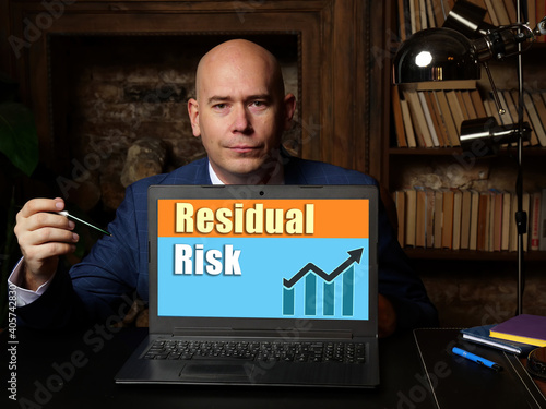 Business concept meaning Residual Risk with phrase on laptop.