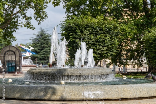 Round fountain made of gray granite in Cyril and Methodius Park