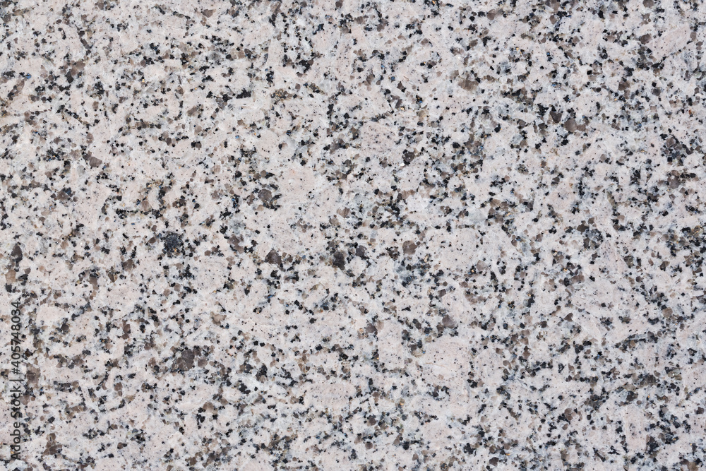 Granite texture. Natural granite with a grainy pattern. Stone background. Solid rough surface of rock. Durable construction and decoration material. Close-up. Granite texture. Natural granite with a grainy pattern. Stone background. Solid rough surface of rock. Durable construction and decoration material. Close-up.