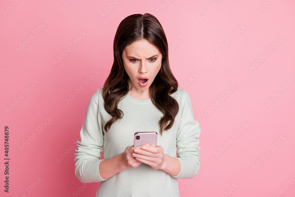 Portrait of impressed lady open mouth staring screen disbelief unfollow isolated on pink color background Portrait of impressed lady open mouth staring screen disbelief unfollow isolated on pink color background