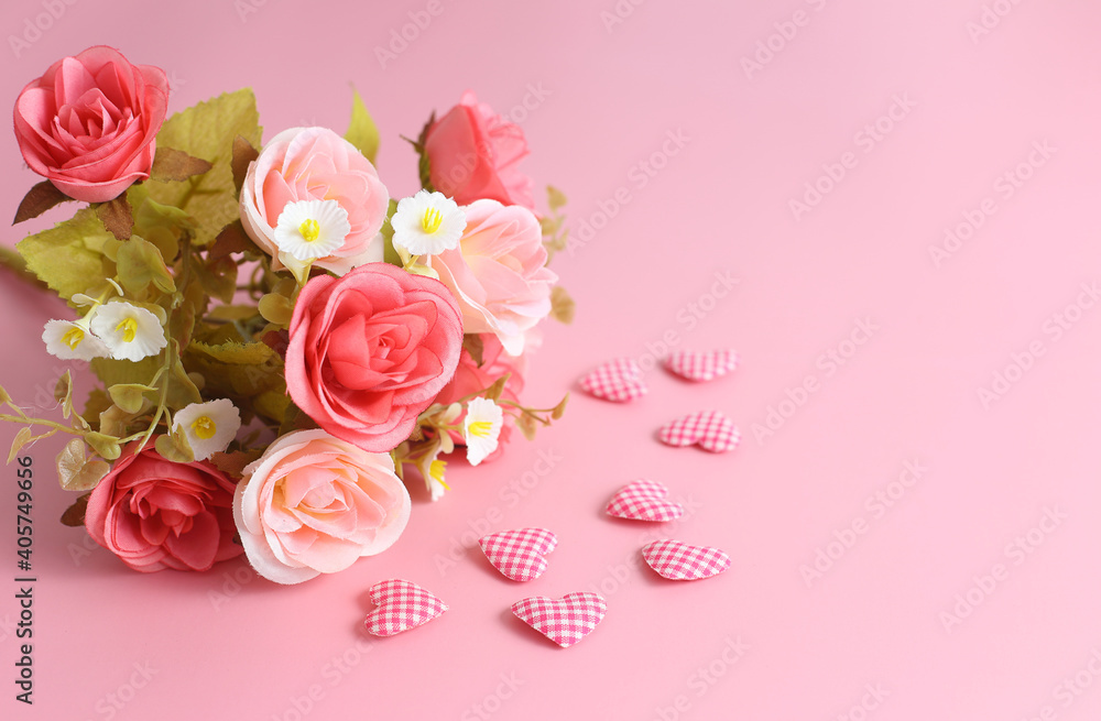 Love background - bouquet of rose and heart shape on pink background