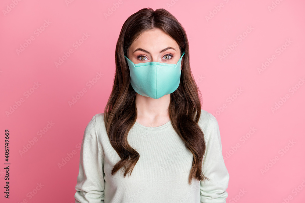 Portrait of young person wearing safety medical respiratory isolated on pastel pink color background Portrait of young person wearing safety medical respiratory isolated on pastel pink color background