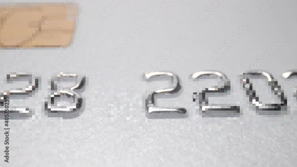 Close up macro of numbers on credit card Close up macro of numbers on credit card