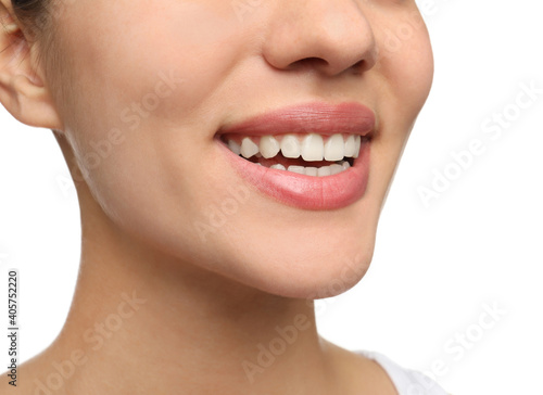 Woman with healthy teeth and beautiful smile on white background  closeup. Cosmetic dentistry