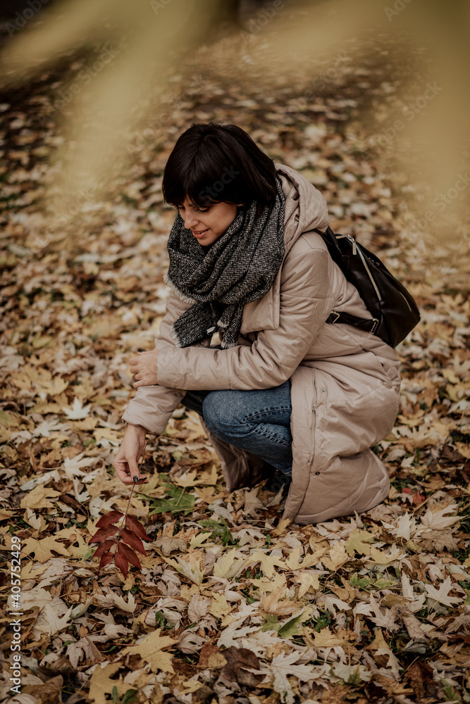 Autumn fall vibes. Happy female with leaves outdoors Autumn fall vibes. Happy female with leaves outdoors