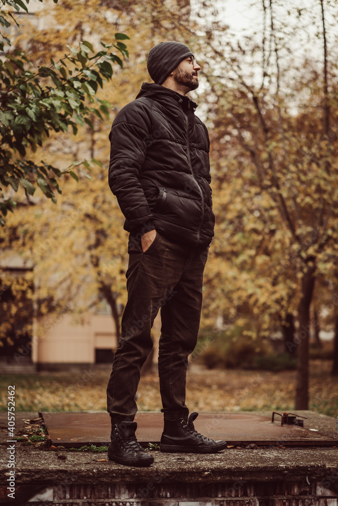 Autumn fall vibes. young male man standing in park