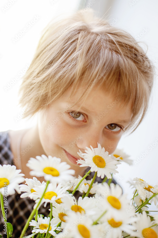 Girl posing with daisies on white background Girl posing with daisies on white background