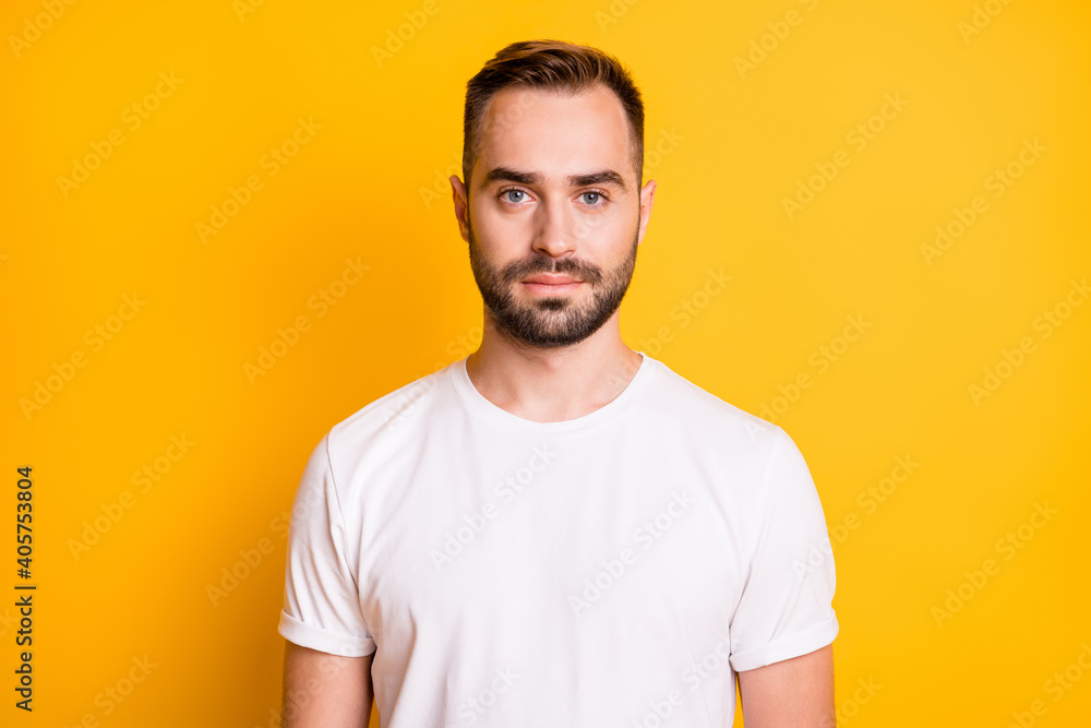 Portrait of optimistic guy wear white t-shirt isolated on vibrant yellow color background Portrait of optimistic guy wear white t-shirt isolated on vibrant yellow color background