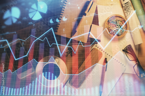 Double exposure of forex graph drawing and work table top veiw. Concept of financial analysis.