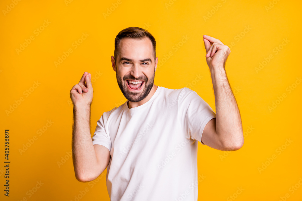 Fototapeta premium Portrait of attractive cheerful funky guy dancing having fun chill out party isolated over bright yellow color background