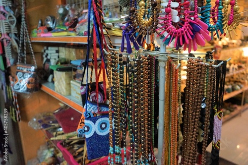 Balinese handmade necklace and clothes in a local souvenir market, Shops and Market on the Street in Ubud , Bali Island, Indonesia