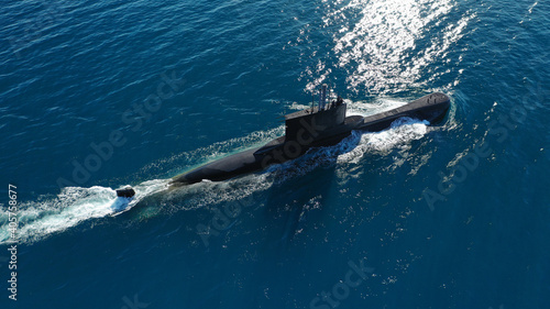 Aerial drone photo of latest technology naval armed forces submarine cruising in deep blue open ocean sea