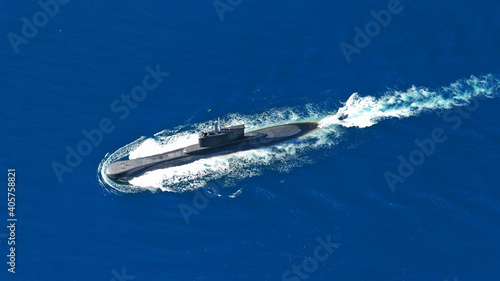 Aerial drone photo of latest technology navy armed diesel powered submarine cruising half submerged