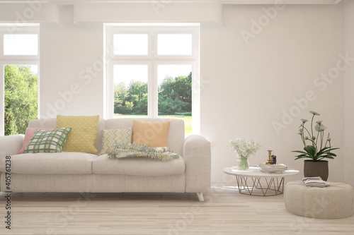 White living room with sofa and summer landscape in window. Scandinavian interior design. 3D illustration © AntonSh