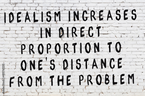 Tableau sur toile White brick wall with painted black inscription of wise quote