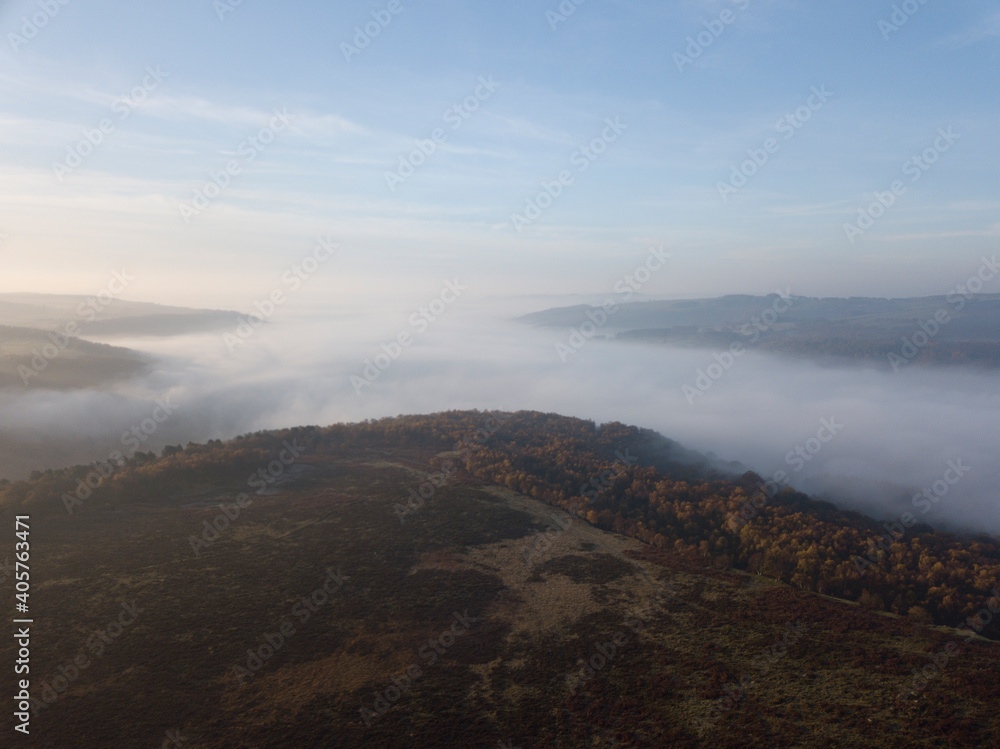 The Peak District at sun rise on an autumn morning with low mist The Peak District at sun rise on an autumn morning with low mist
