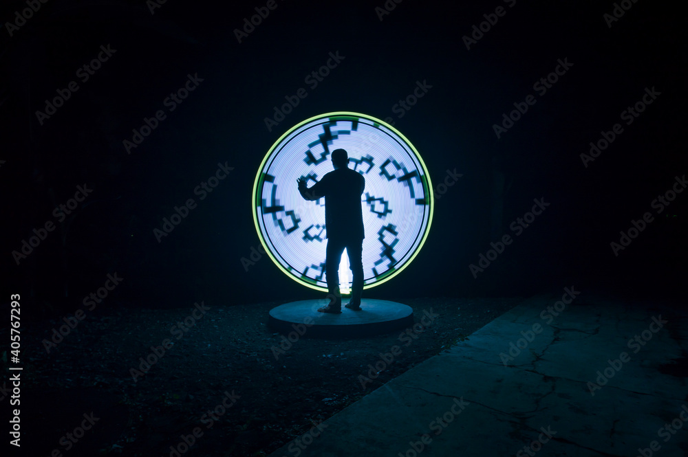 one person standing against beautiful White and yellow circle light painting as the backdrop one person standing against beautiful White and yellow circle light painting as the backdrop