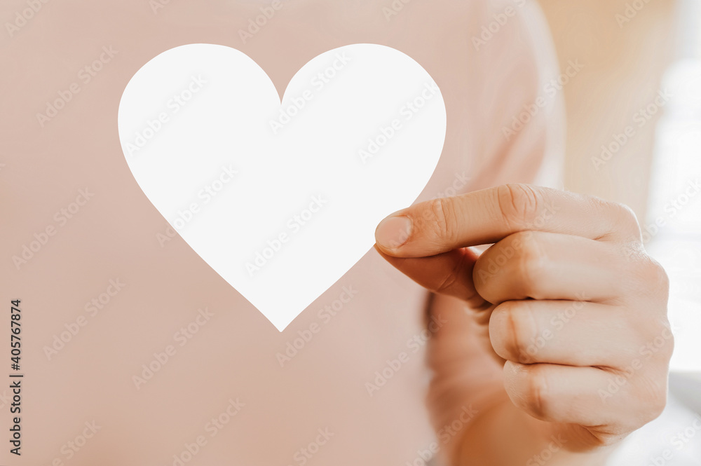 Man holding a love card in the shape of a heart with blank background Man holding a love card in the shape of a heart with blank background