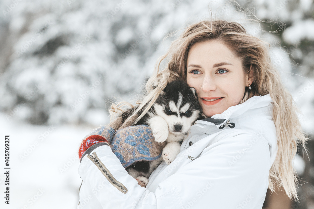 Girl playing with siberian husky in winter forest and park Girl playing with siberian husky in winter forest and park