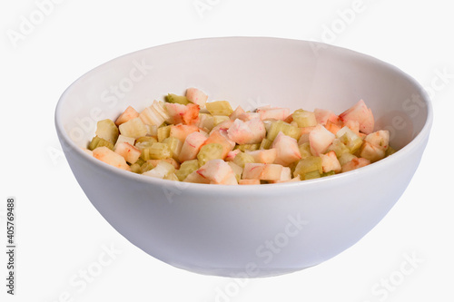 Cup with vegetable salad on a white background