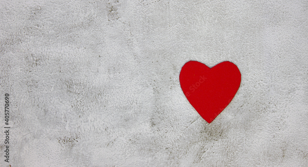 Red heart on a gray background. Background for design. Celebration of St. Valentina Red heart on a gray background. Background for design. Celebration of St. Valentina
