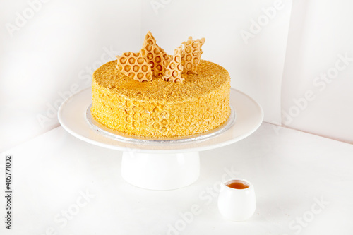 Golden honey seven layered cake with honey comb biscuit